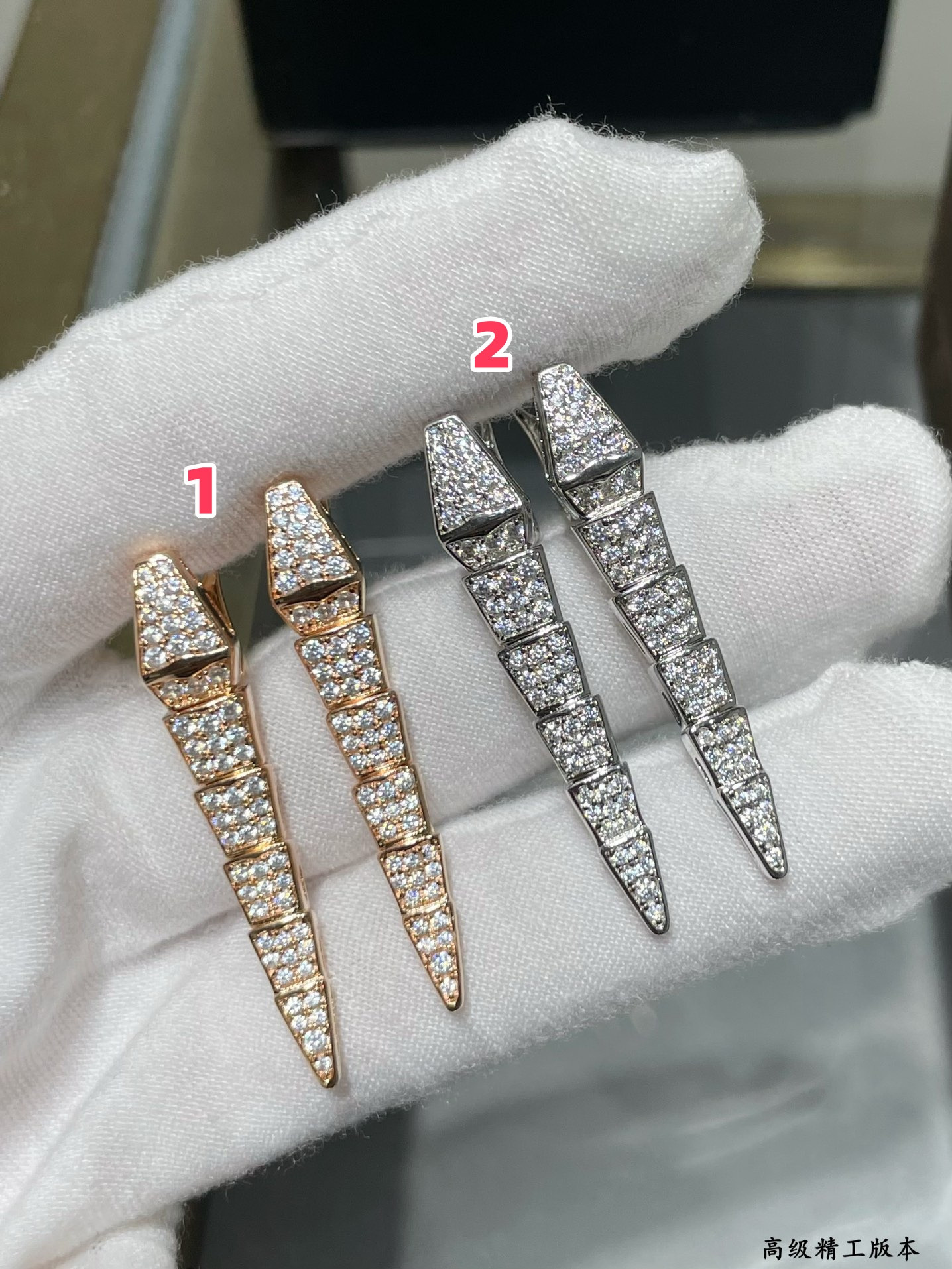 B*l*ai full-level drill snake earrings